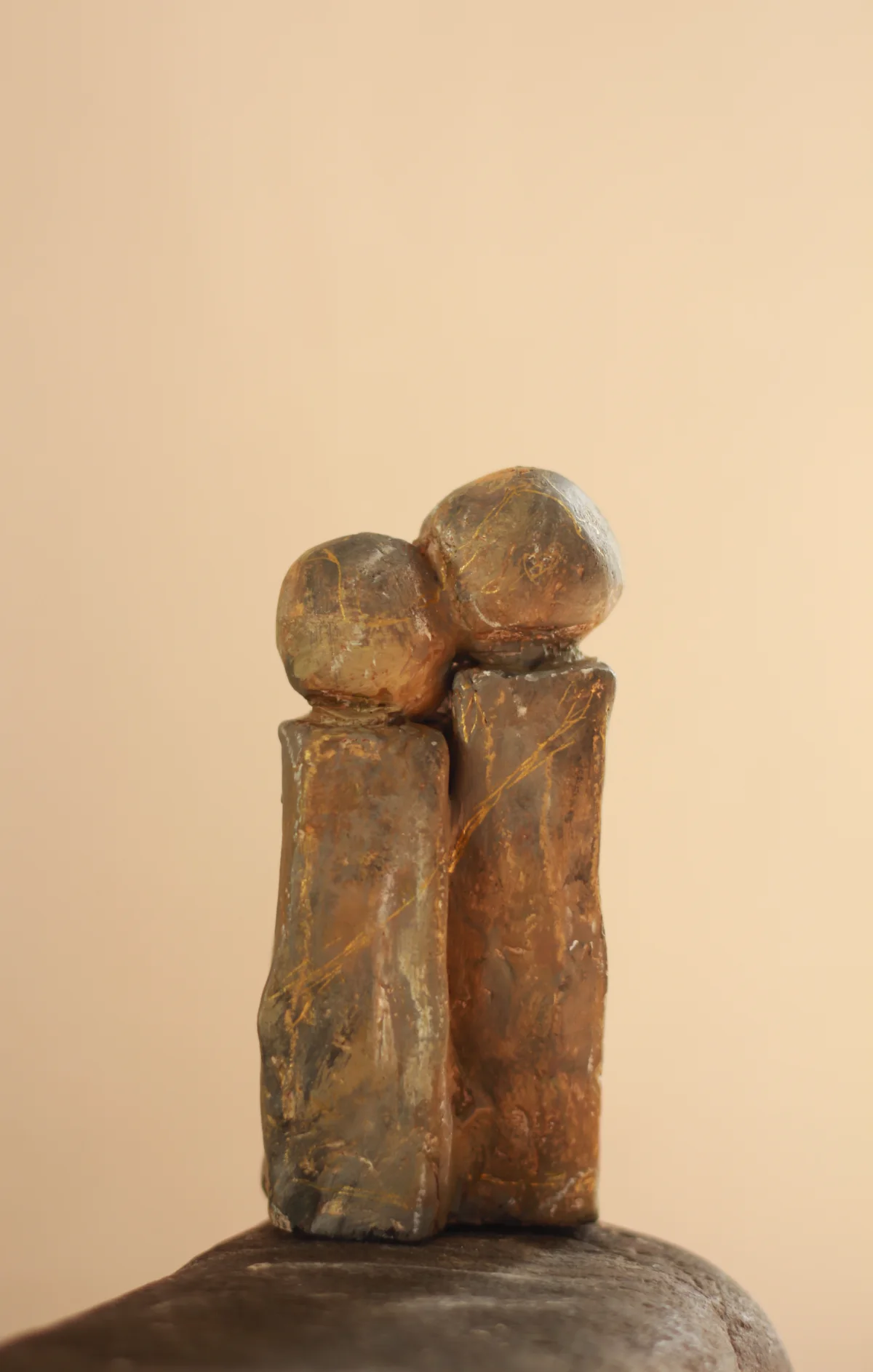 Two handmade figurines leaning their heads together